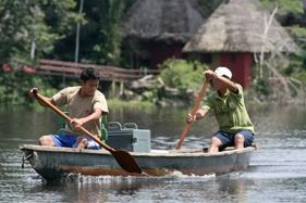 Paddling canoes on the Napo river